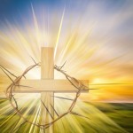 Happy Easter greeting card or background with a cross, crown of thorns and colorful abstract blur background like a meadow at sunset, with copy space for text.